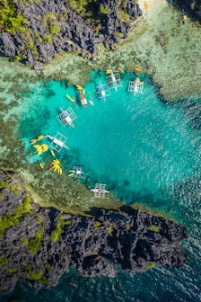 aerial view of white and brown boat on sea during daytime