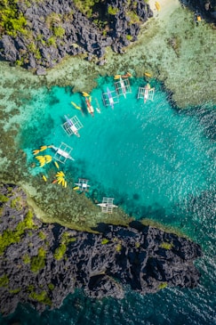 aerial view of white and brown boat on sea during daytime