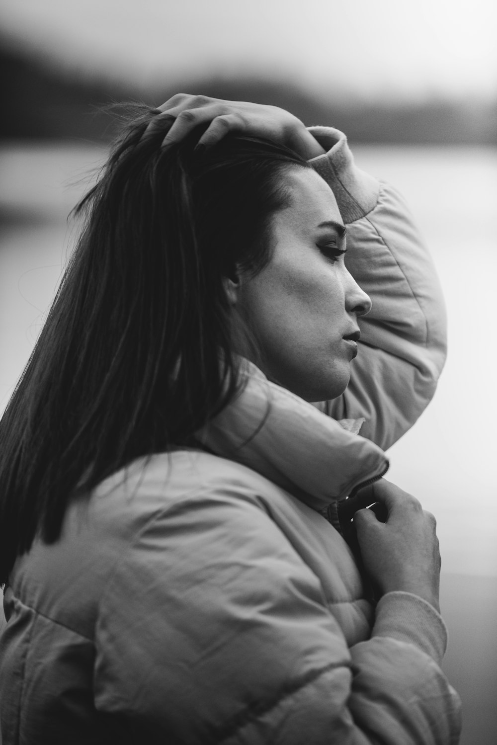 grayscale photo of woman in hoodie