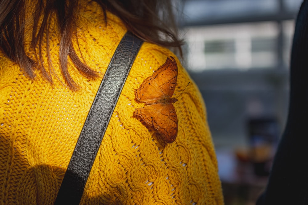 woman in yellow knit shirt