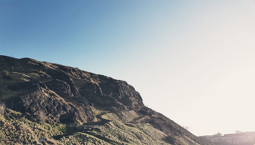 brown and green mountain under blue sky during daytime