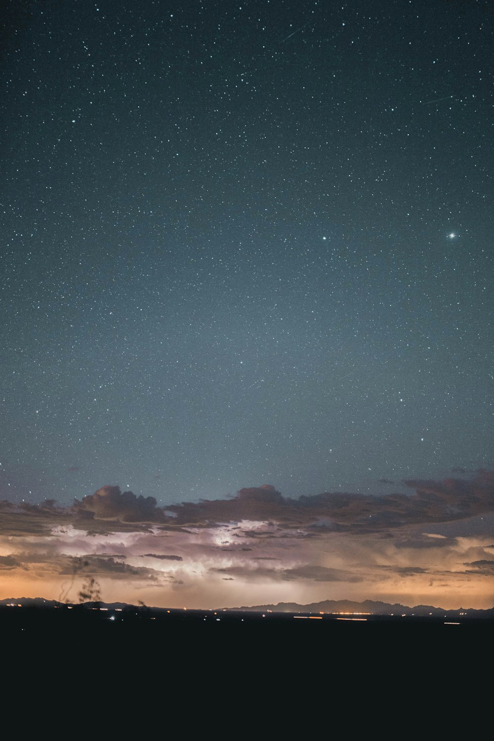 silhouette of mountain under blue sky during night time