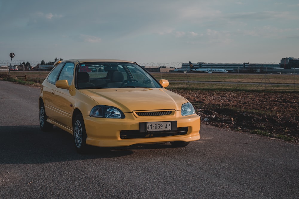 yellow bmw m 3 on road during daytime