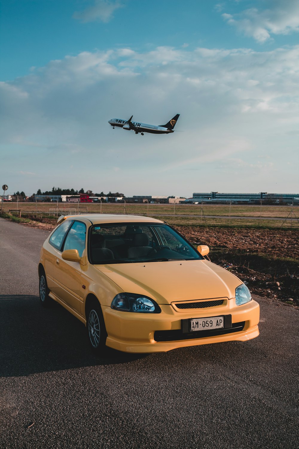 yellow bmw m 3 on road during daytime