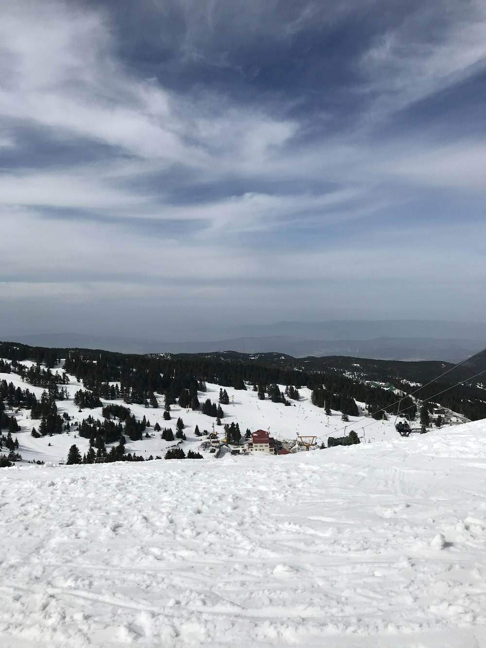 people on snow covered mountain under cloudy sky during daytime