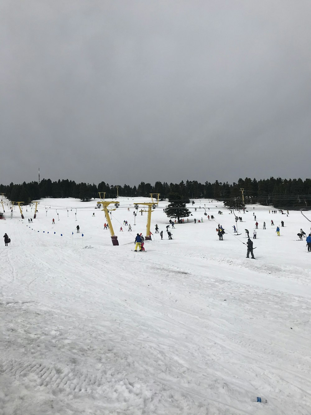 people on snow covered field during daytime