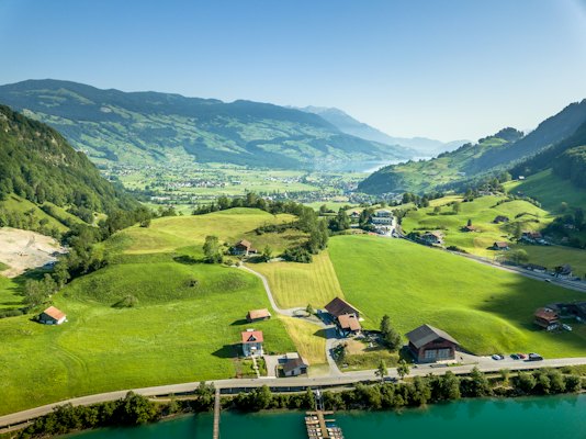Green grass field near lake during daytime — Bern, Switzerland