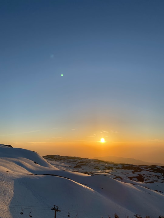 snow covered mountain during sunset in Mount Lebanon Lebanon