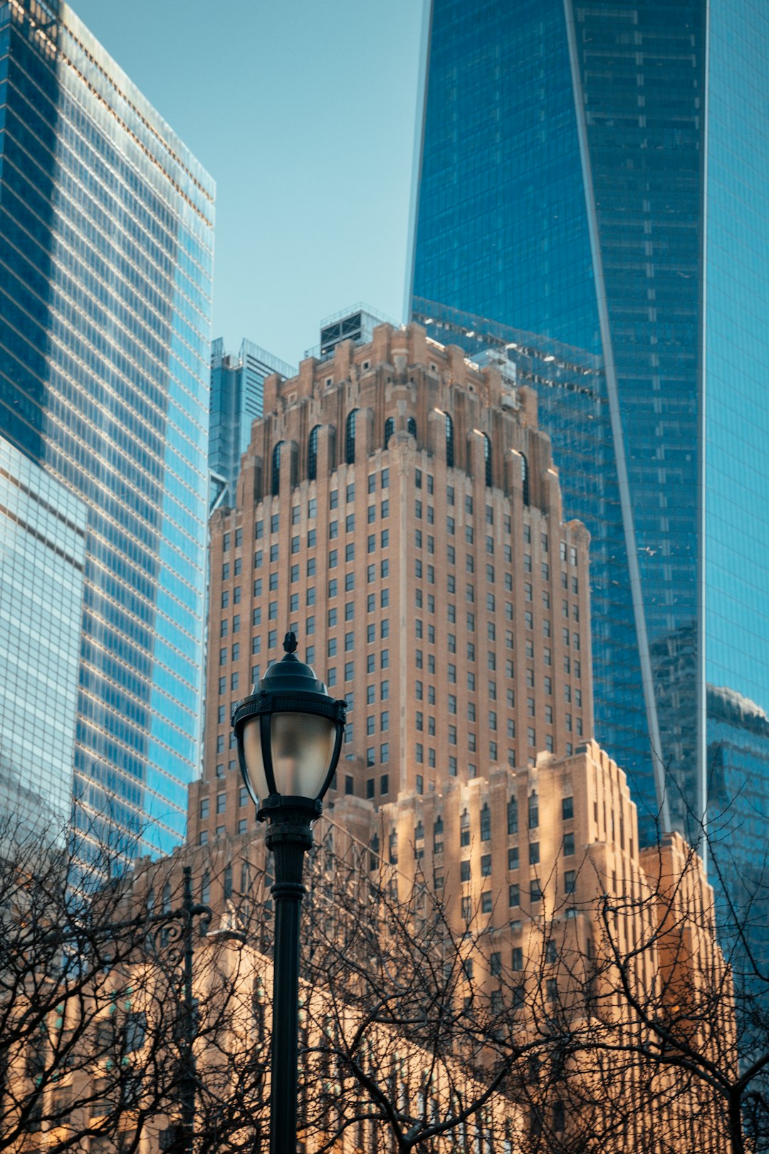 black street light near high rise buildings during daytime