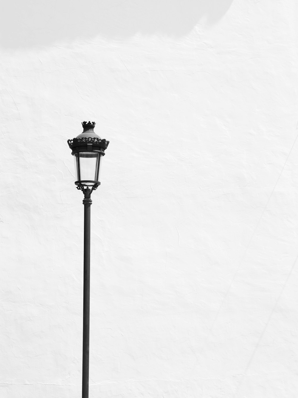 black street light post with white background