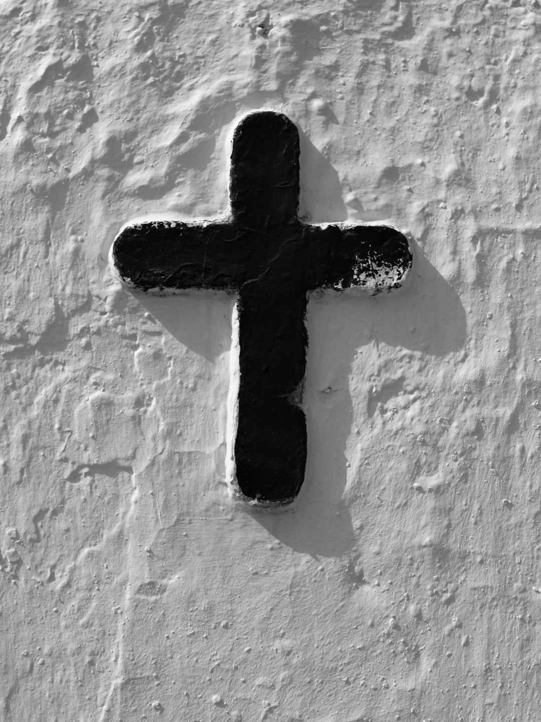 white and black cross wall decor