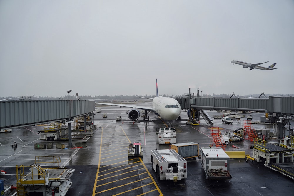 white airplane on airport during daytime