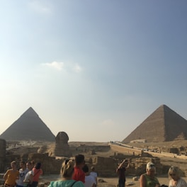 A traveler enjoying a guided tour at an ancient Egyptian landmark.