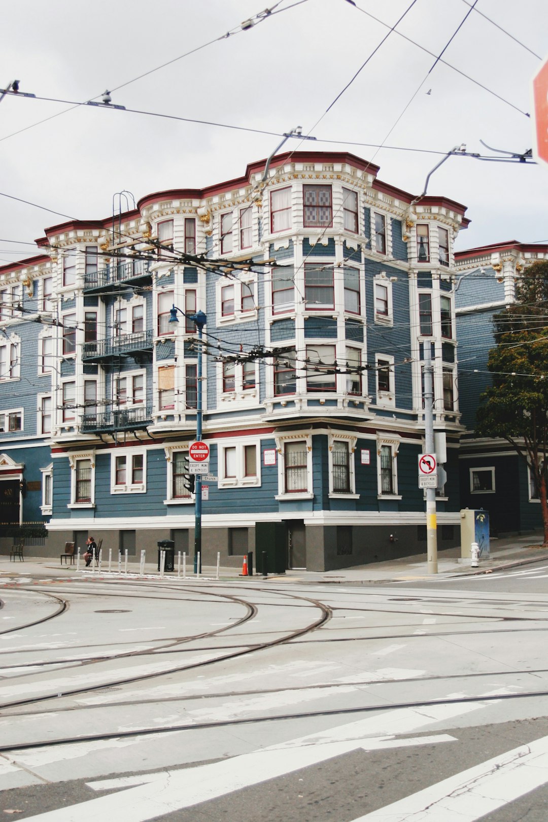 white and brown concrete building near road during daytime