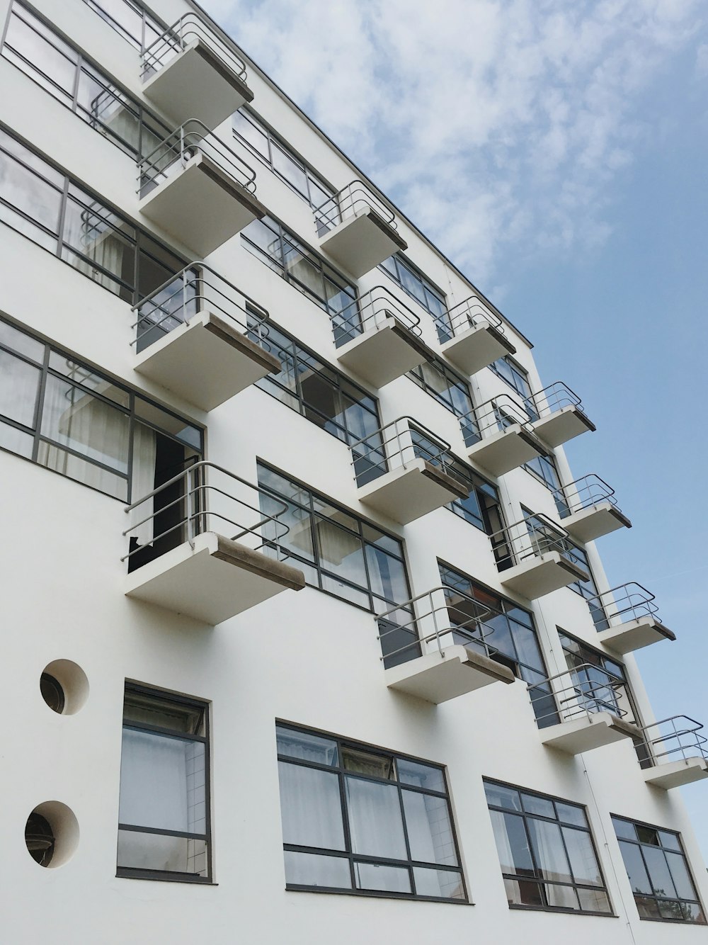 white concrete building under blue sky during daytime