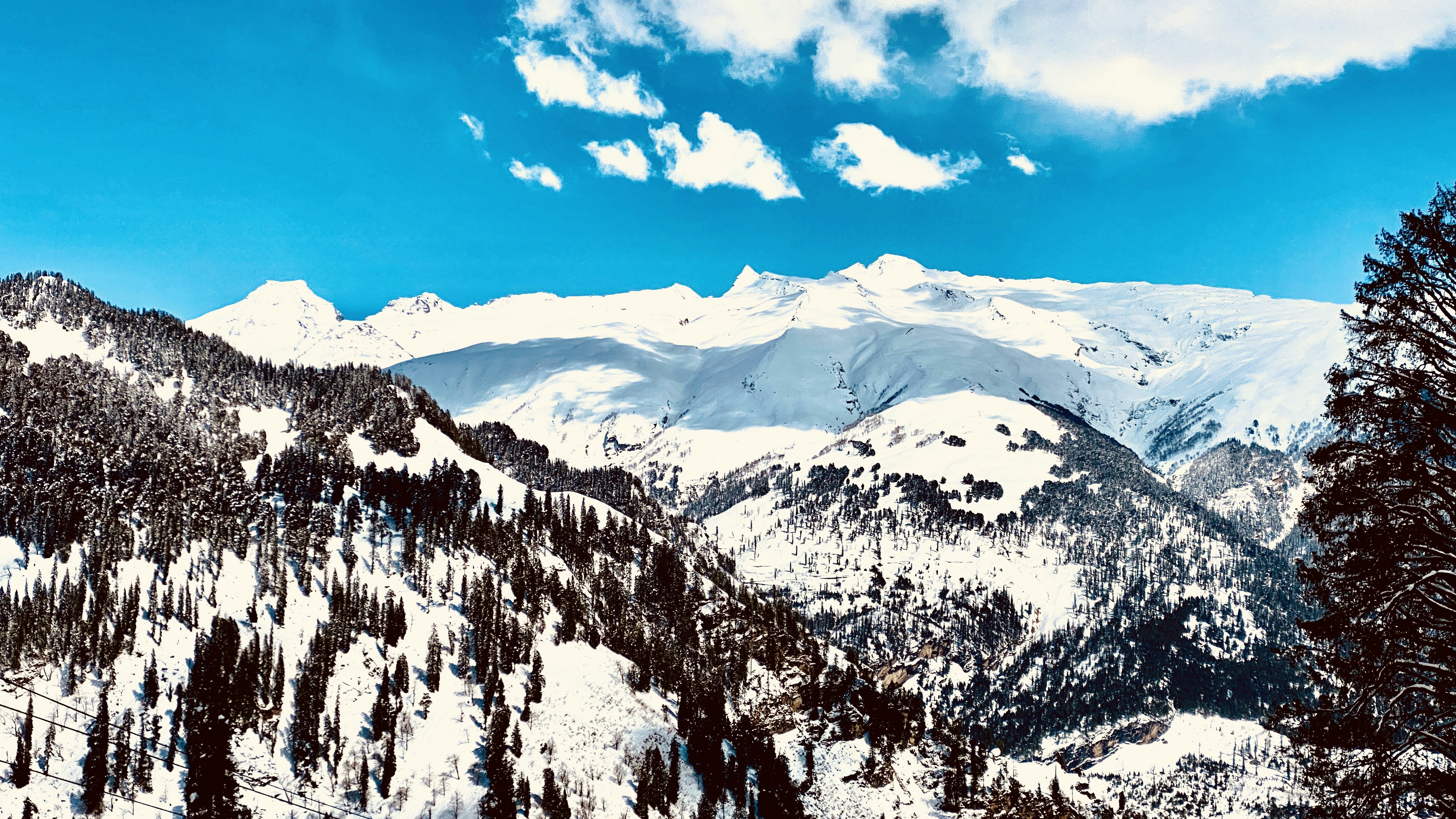 snow covered mountain under blue sky during daytime