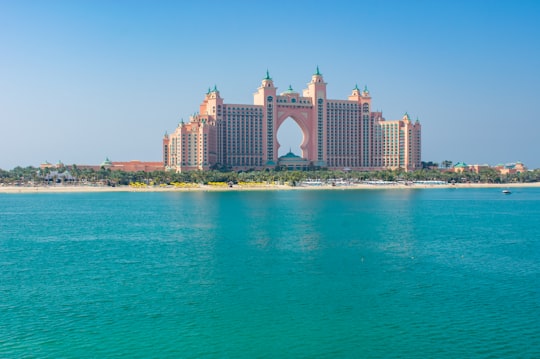 white concrete building near body of water during daytime in Atlantis, The Palm United Arab Emirates