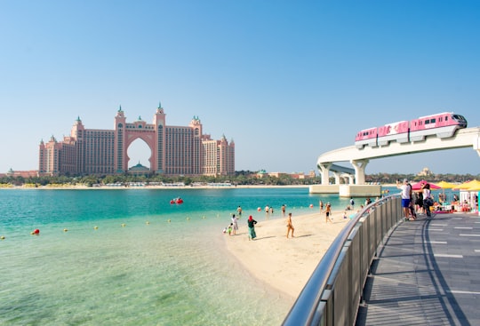 people on beach during daytime in Atlantis, The Palm United Arab Emirates
