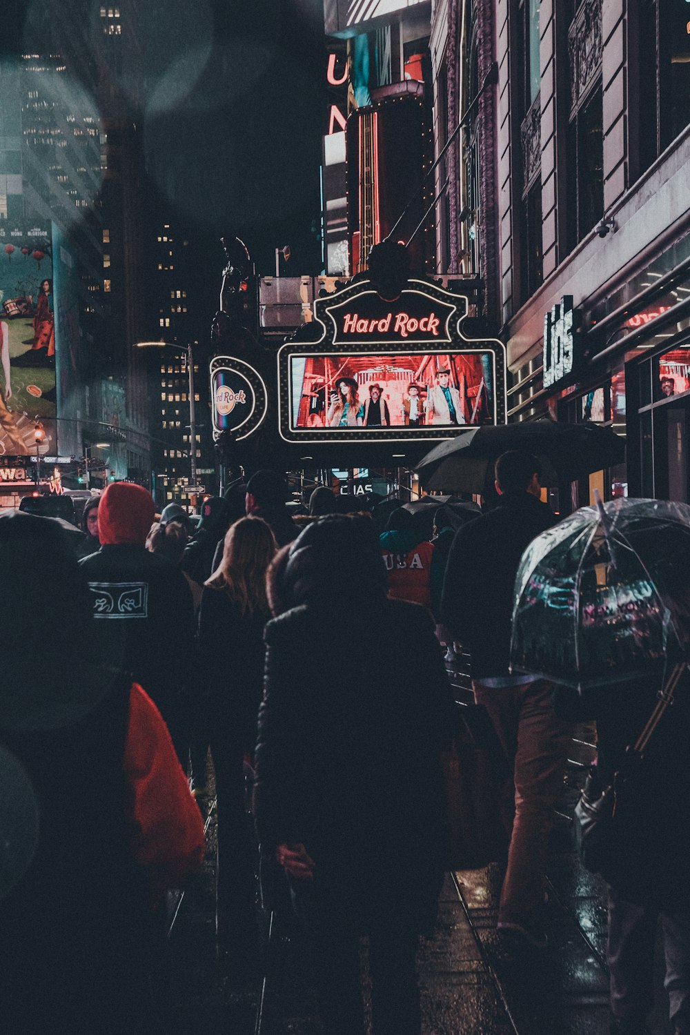 people walking on street during nighttime