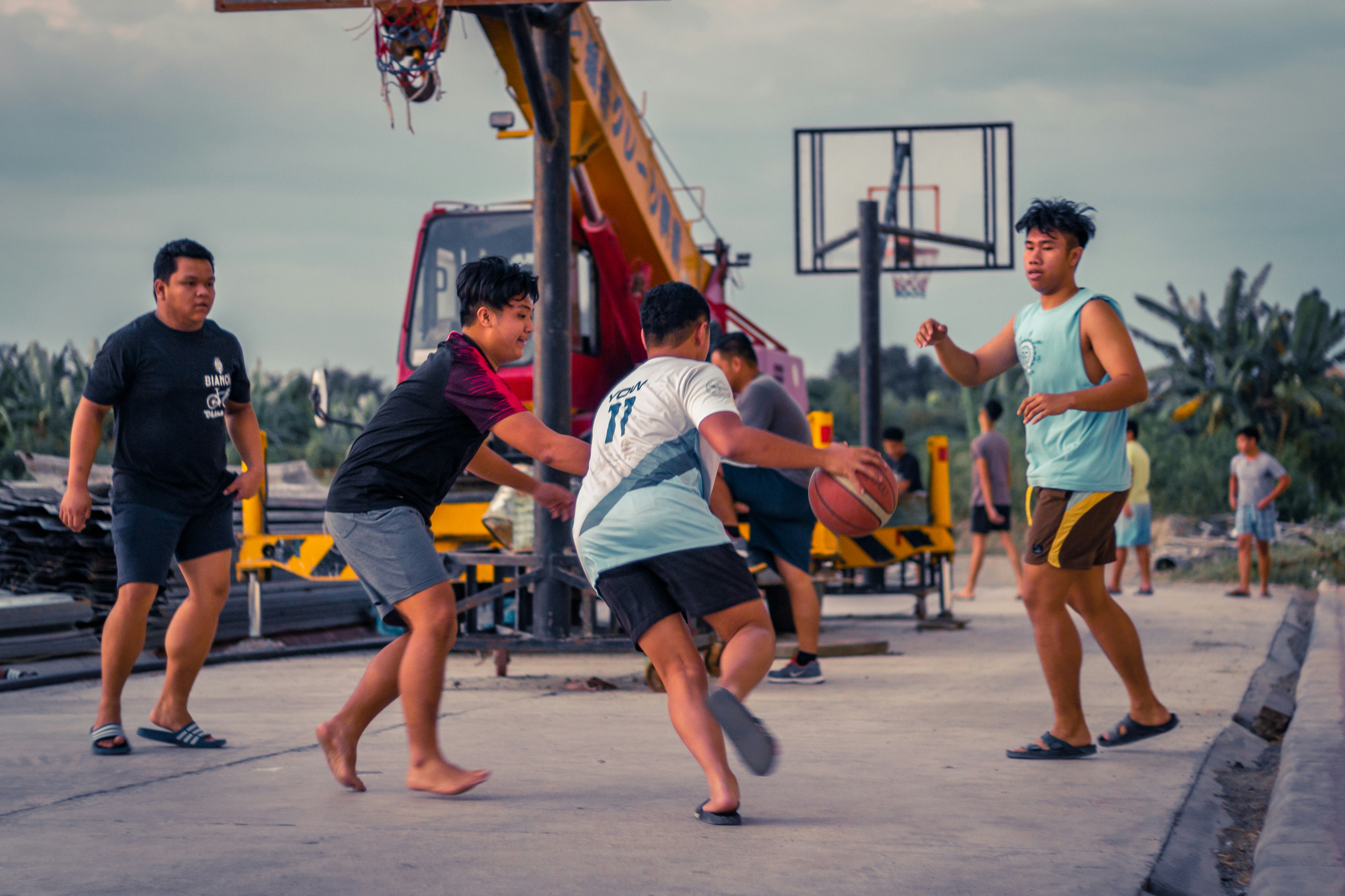 teenagers playing basketball