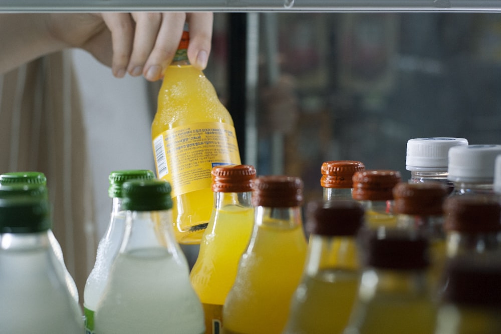 yellow labeled plastic bottles on shelf
