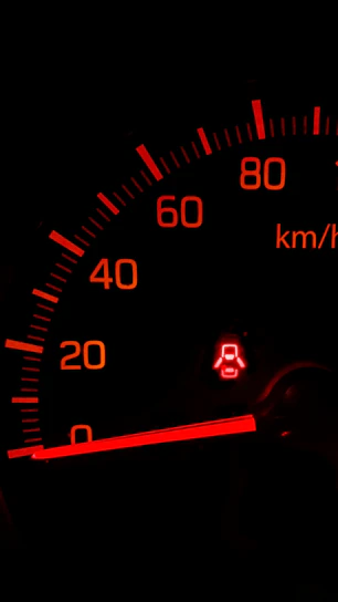 black and red speedometer at 0