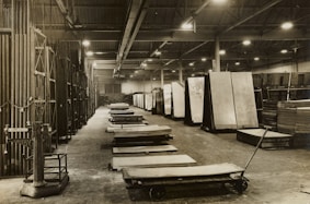 grayscale photo of a room with chairs and tables