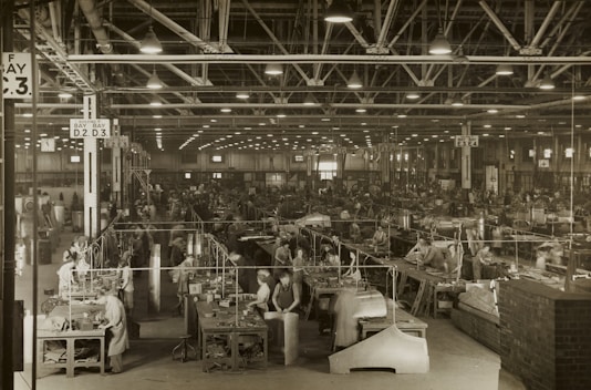 Workers collaborating in a manufacturing setting.