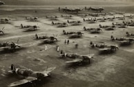 Various aircraft spare parts laid out in organized storage racks.
