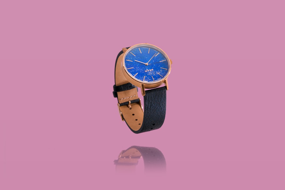 blue and gold analog watch