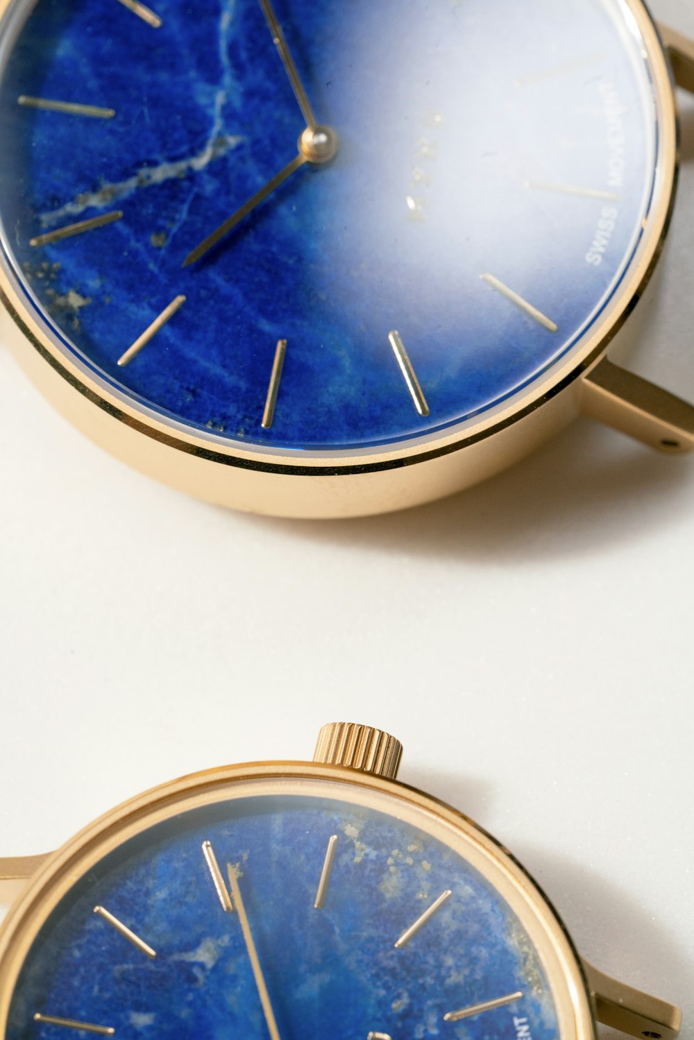 gold and silver round analog watch