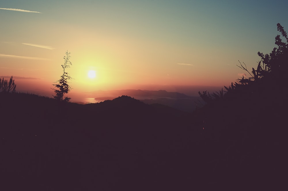 silhouette of mountain during sunset