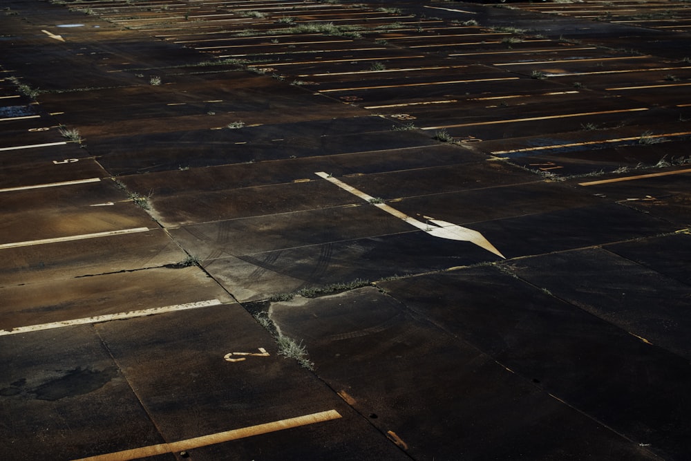 white paper plane on brown wooden floor