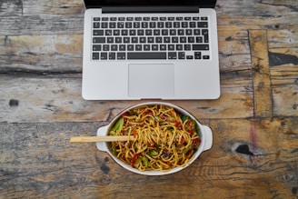 white macbook air on brown wooden table