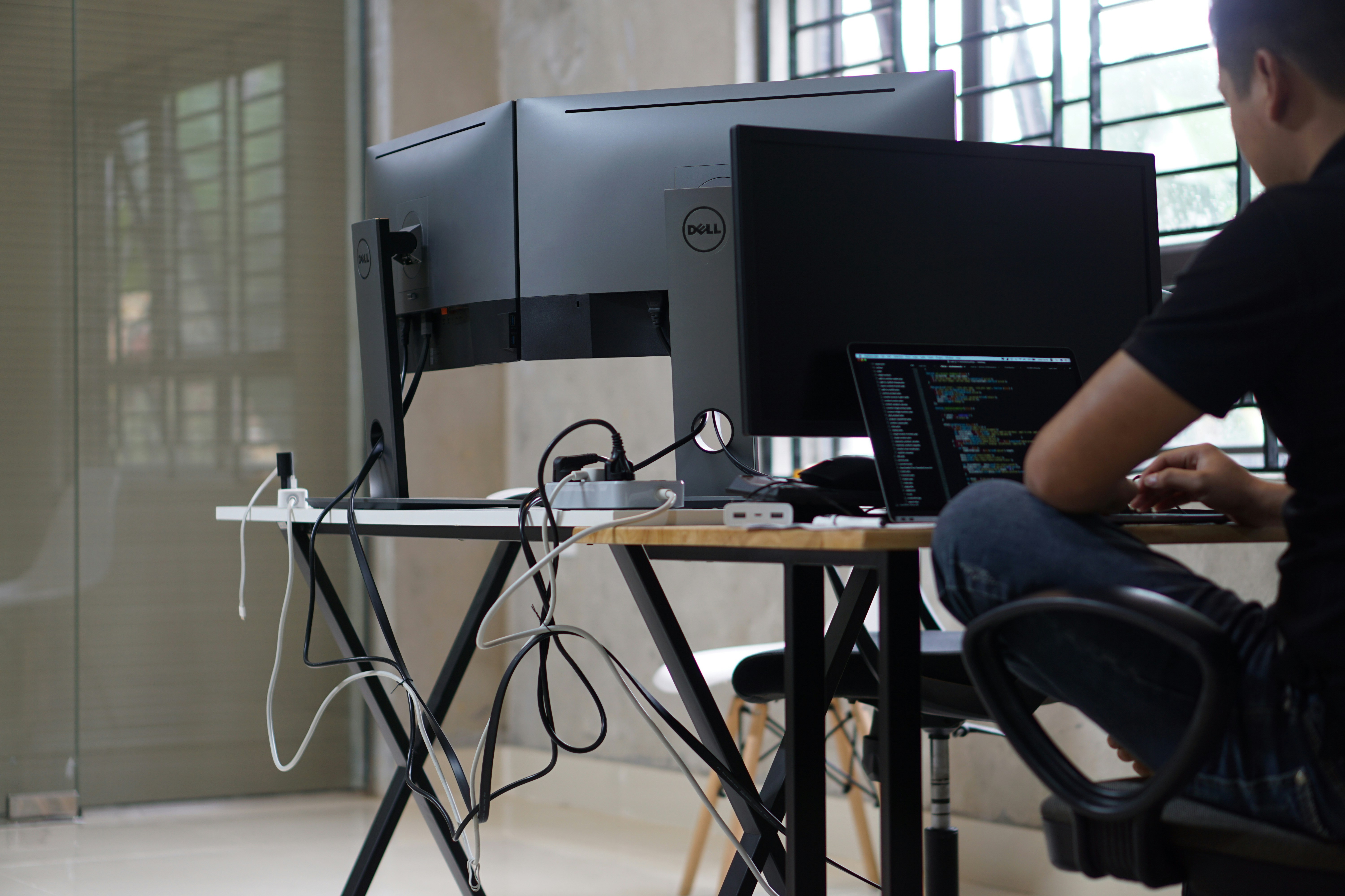black flat screen computer monitor on brown wooden table