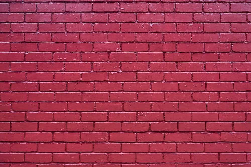 red brick wall during daytime