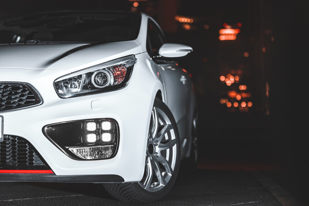 white bmw m series on road during night time