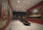 A prestigious gallery showcasing Dream Art tableaux in a warm, inviting setting.