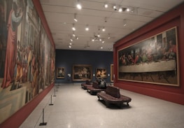 A prestigious gallery showcasing Dream Art tableaux in a warm, inviting setting.