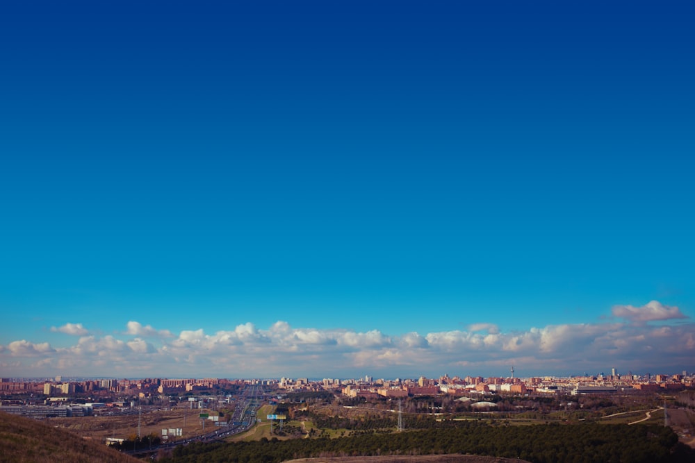 city with high rise buildings under blue sky during daytime