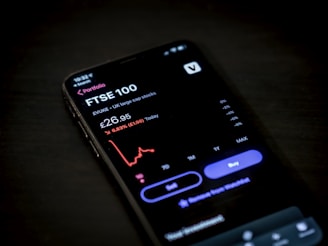 black android smartphone on brown wooden table