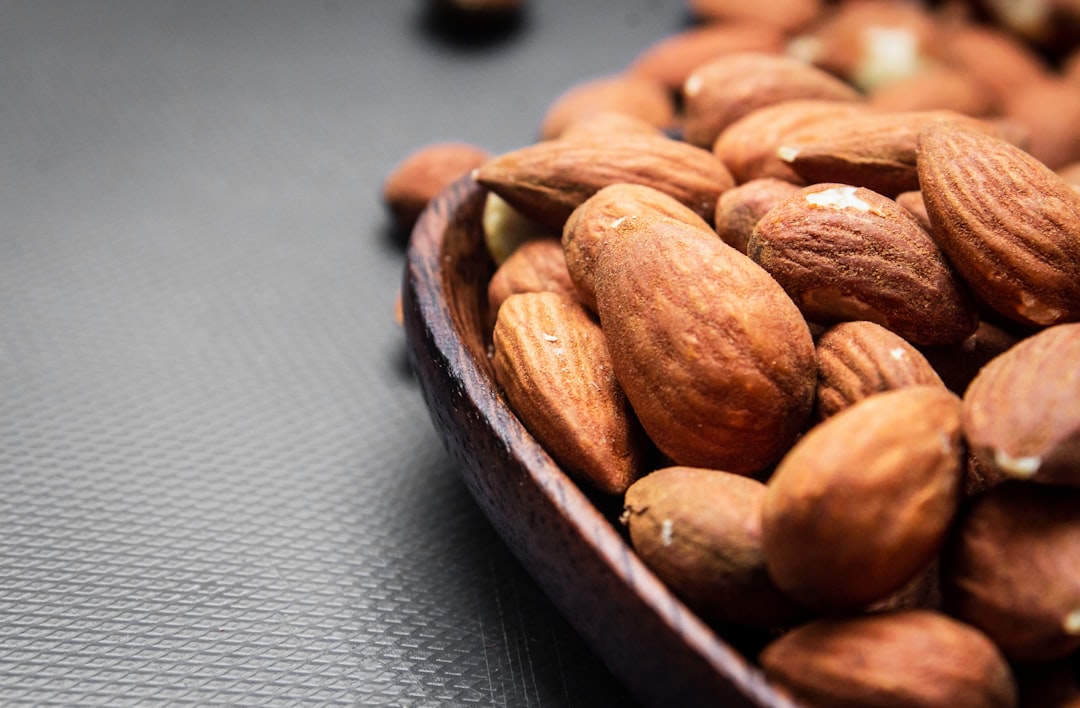 brown nuts on brown wooden bowl