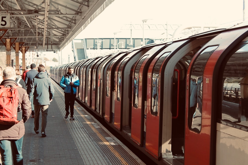 people walking on train station during daytime