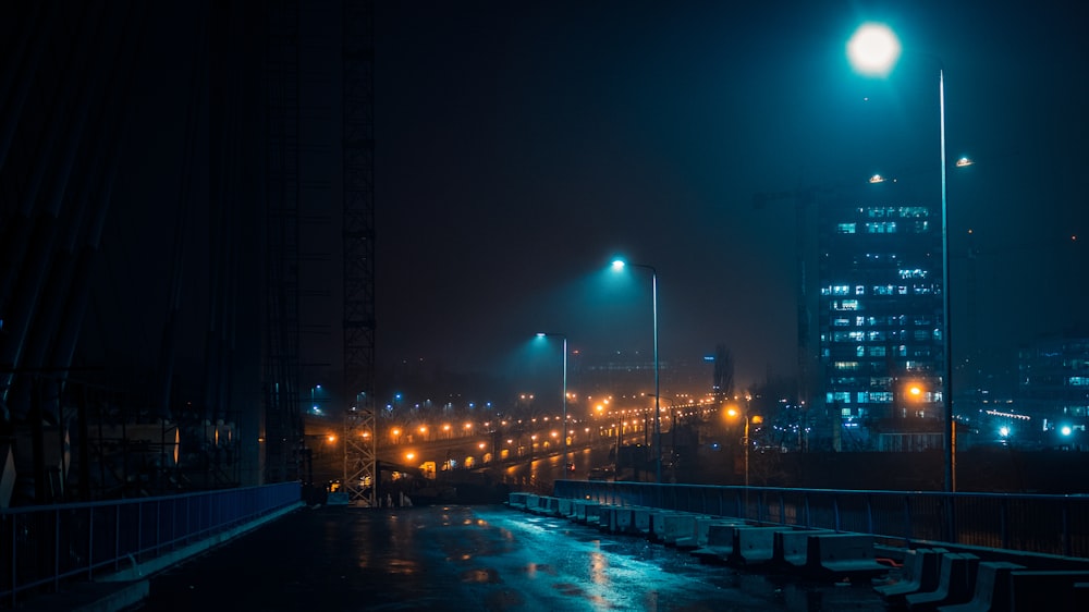 people walking on sidewalk during night time