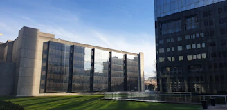 Two office buildings representing the Arezzo and Siena law firm locations.