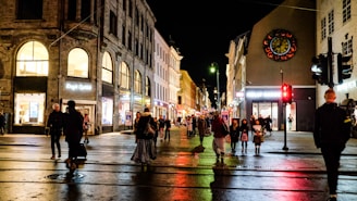 people walking on street during night time