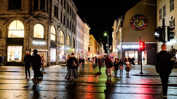 people walking on street during night time