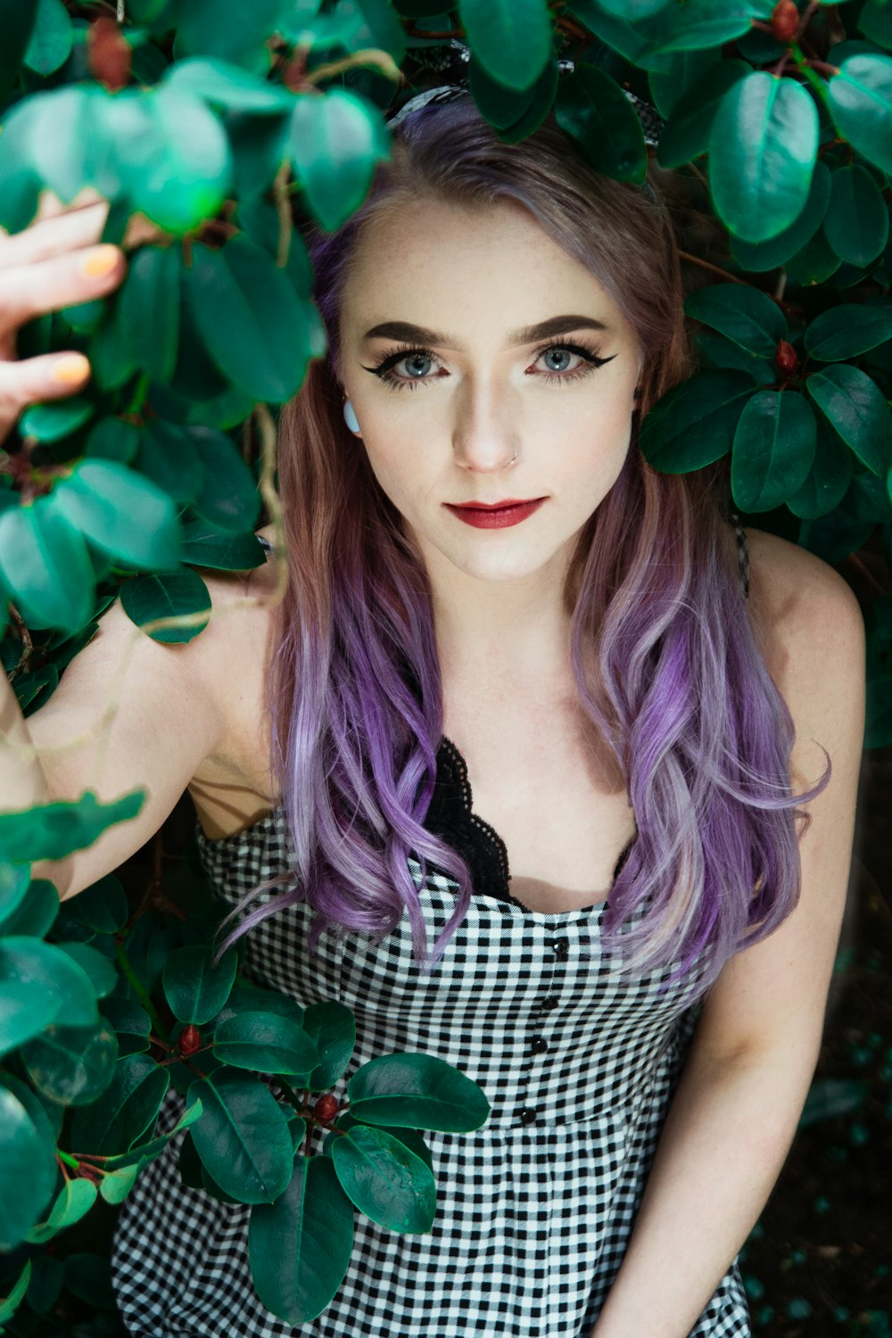 woman in black and white checkered sleeveless dress