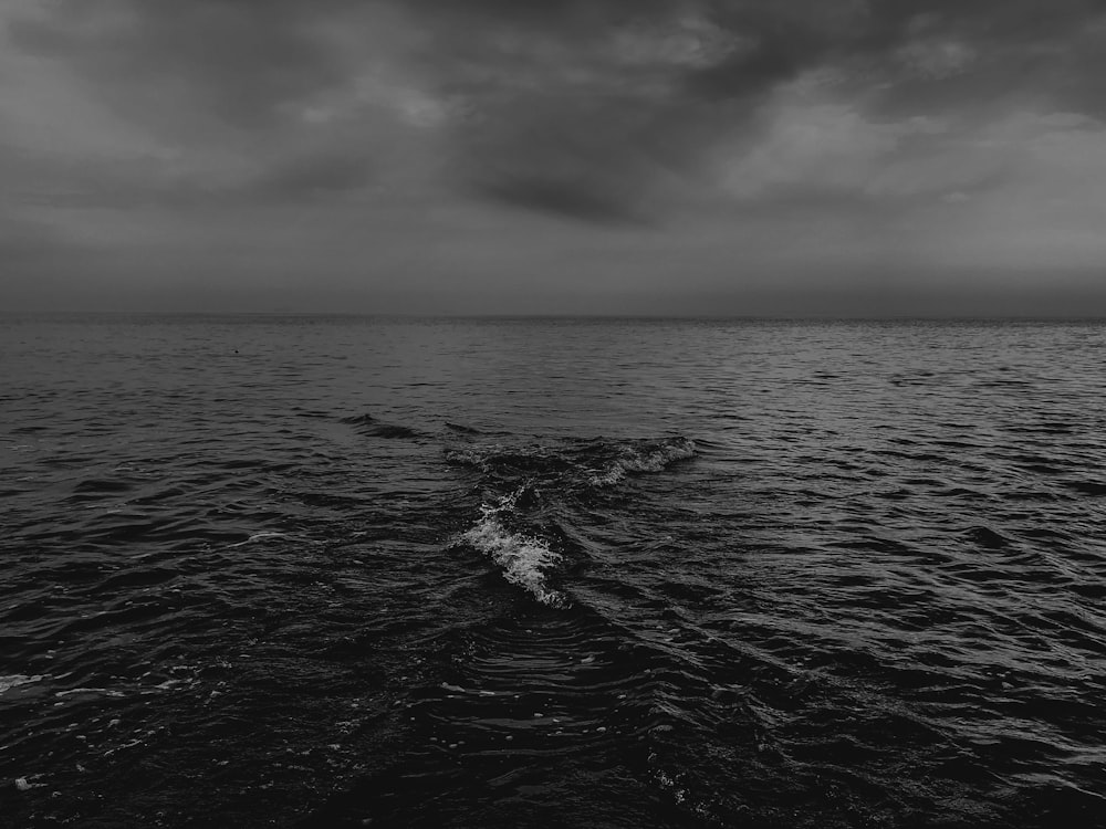 grayscale photo of sea waves