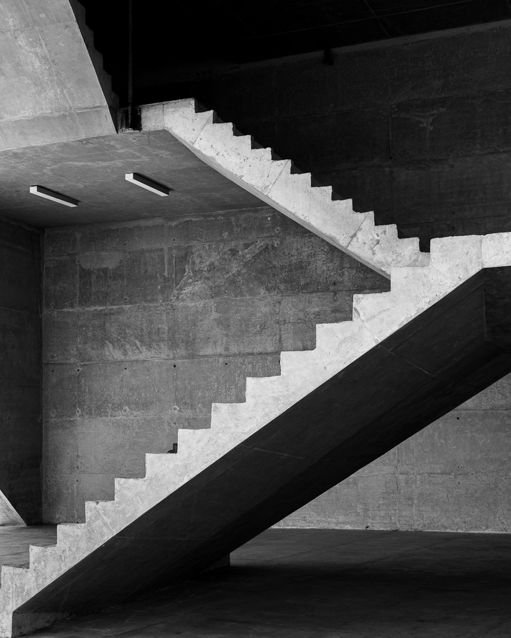 grayscale photo of concrete staircase